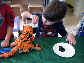 painting_h child painting a tiger sculpture